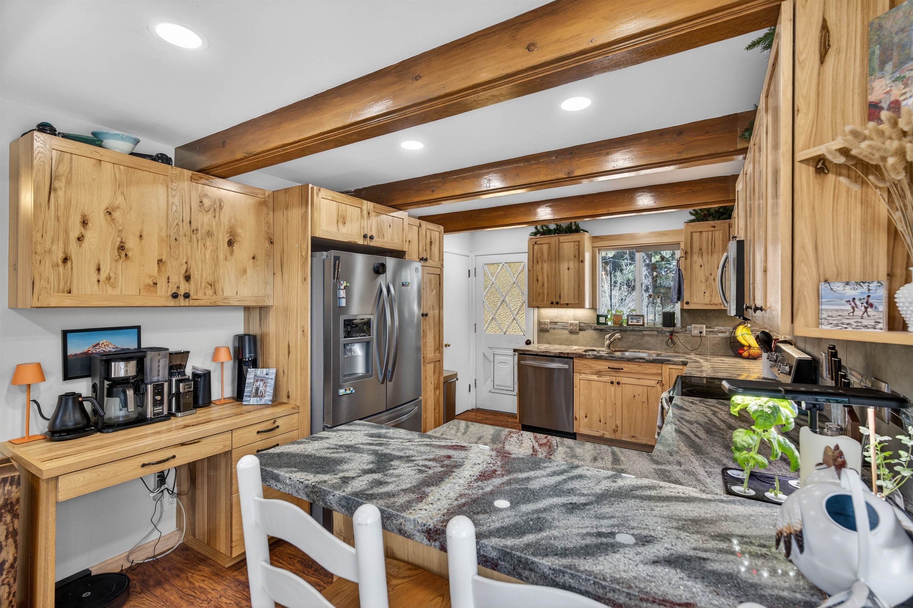 10220 Columbine Road Truckee, CA 96161 - Photo 10 of 28 a kitchen with stainless steel appliances granite countertop a sink stove and refrigerator