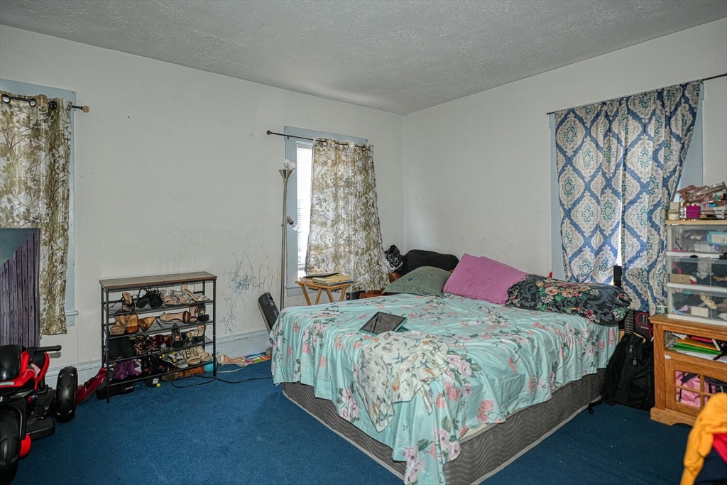 7 Prospect Street Woburn, MA 01801 - Photo 13 of 41 a bedroom with a bed furniture and a window