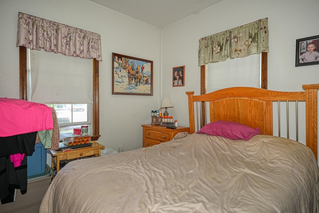 7 Prospect Street Woburn, MA 01801 - Photo 16 of 41 a bedroom with a bed and a couch