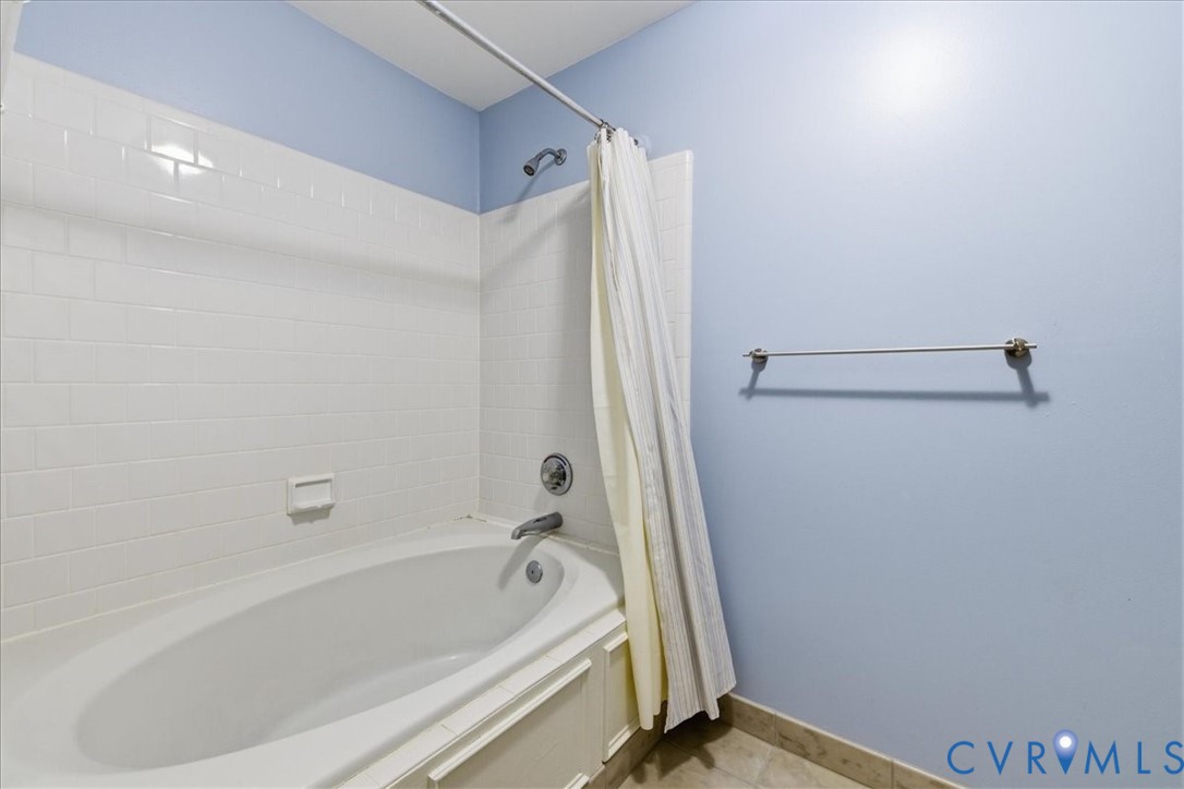 4099 Doe Run Road Hopewell, VA 23860 - Photo 18 of 36 Alcove bathtub with white subway tile surround and