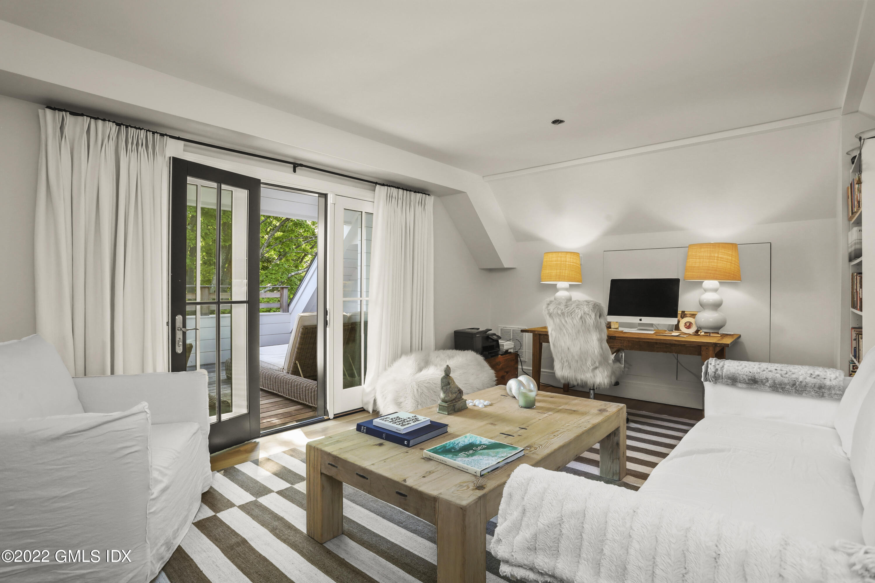 27 Linwood Avenue Riverside, CT 06878 - Photo 12 of 23 a bedroom with a bed and wooden floor