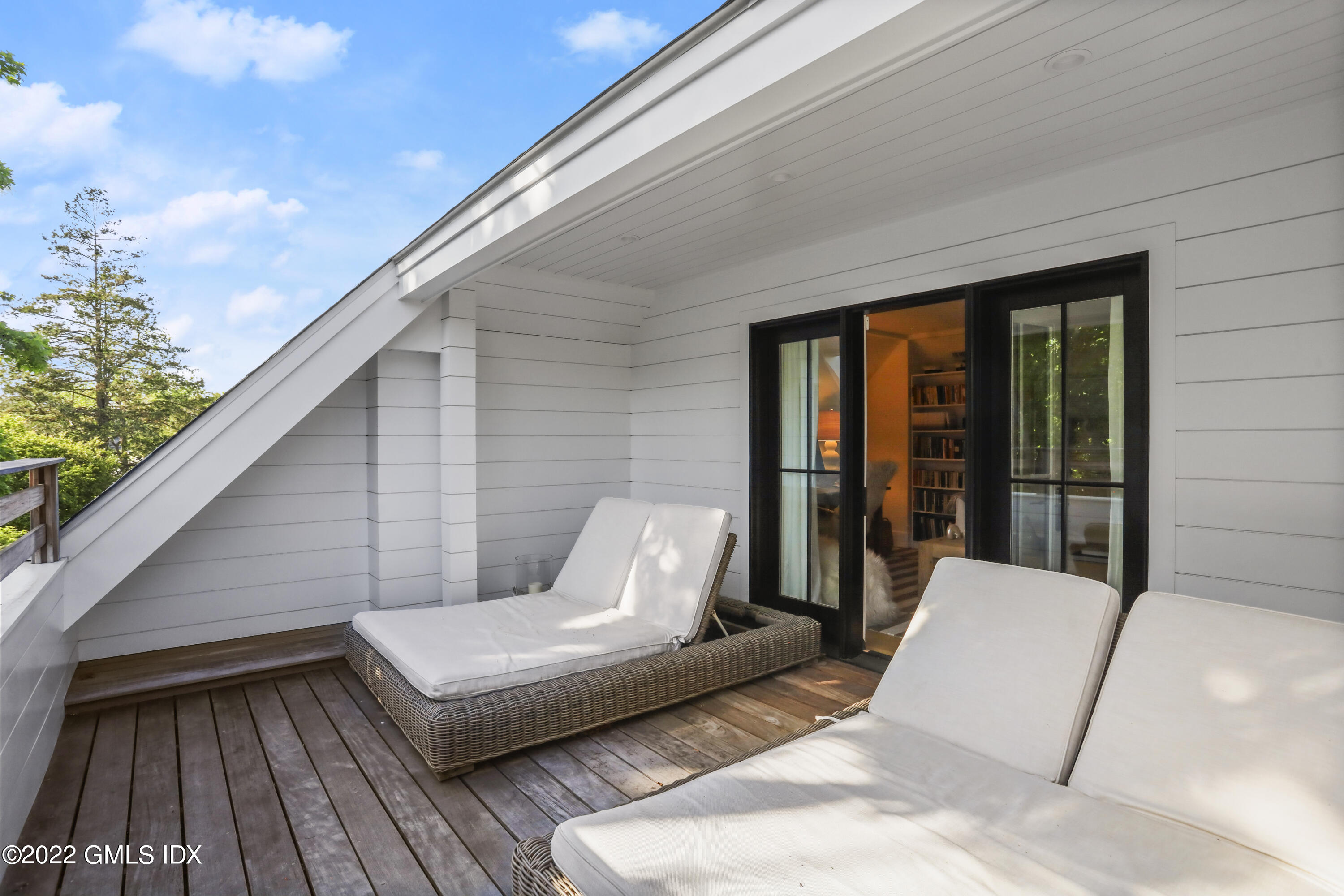 27 Linwood Avenue Riverside, CT 06878 - Photo 13 of 23 a balcony with furniture and wooden floor