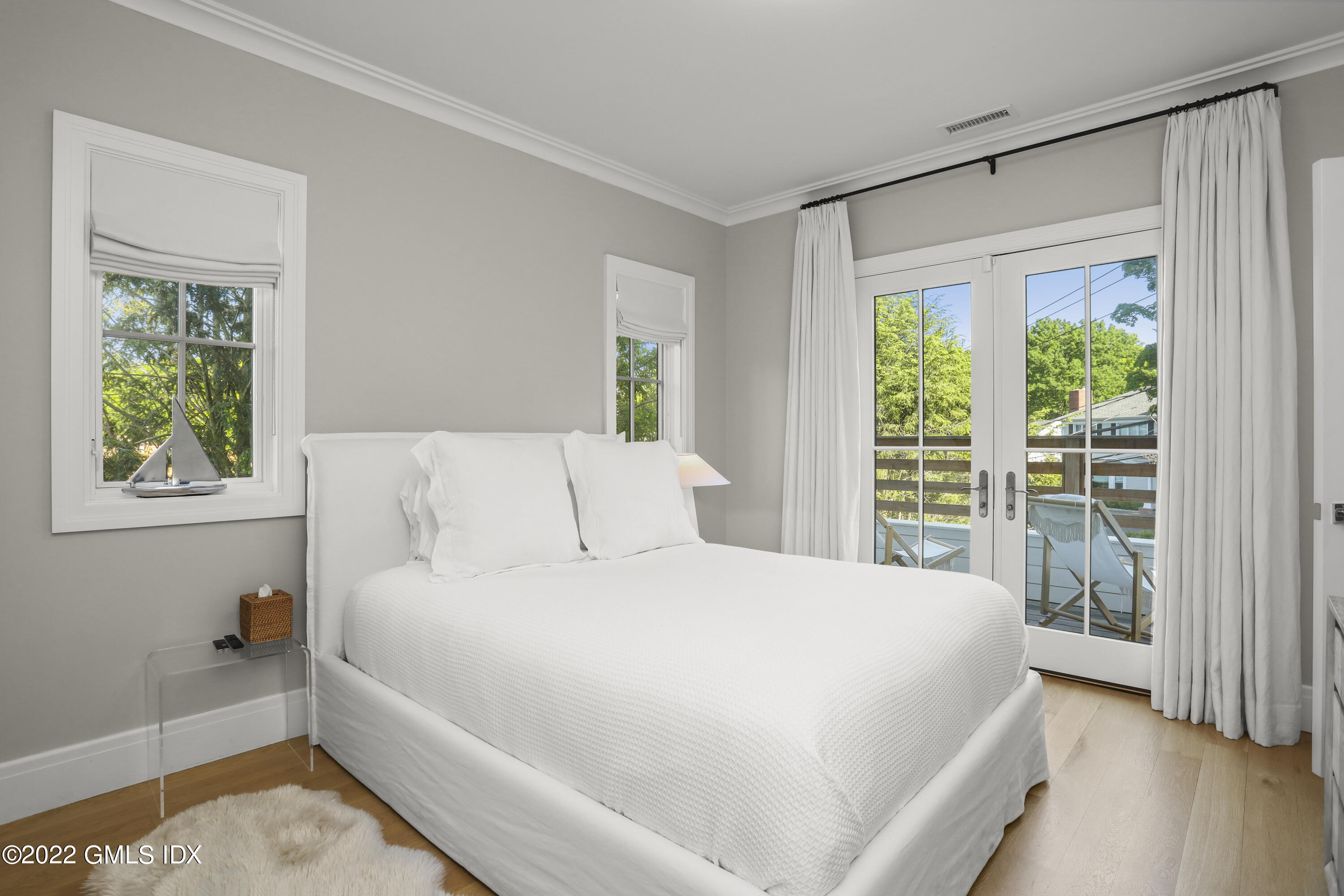 27 Linwood Avenue Riverside, CT 06878 - Photo 15 of 23 a large bed sitting in a bedroom next to a window