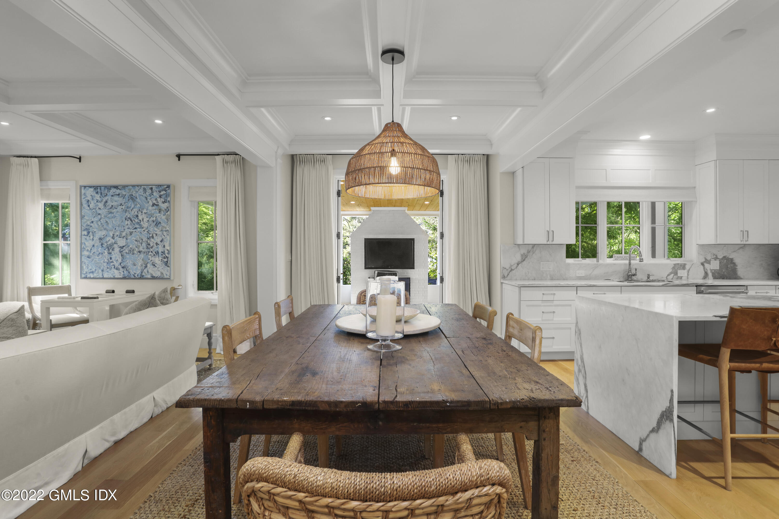 27 Linwood Avenue Riverside, CT 06878 - Photo 4 of 23 a kitchen with a table chairs and a chandelier
