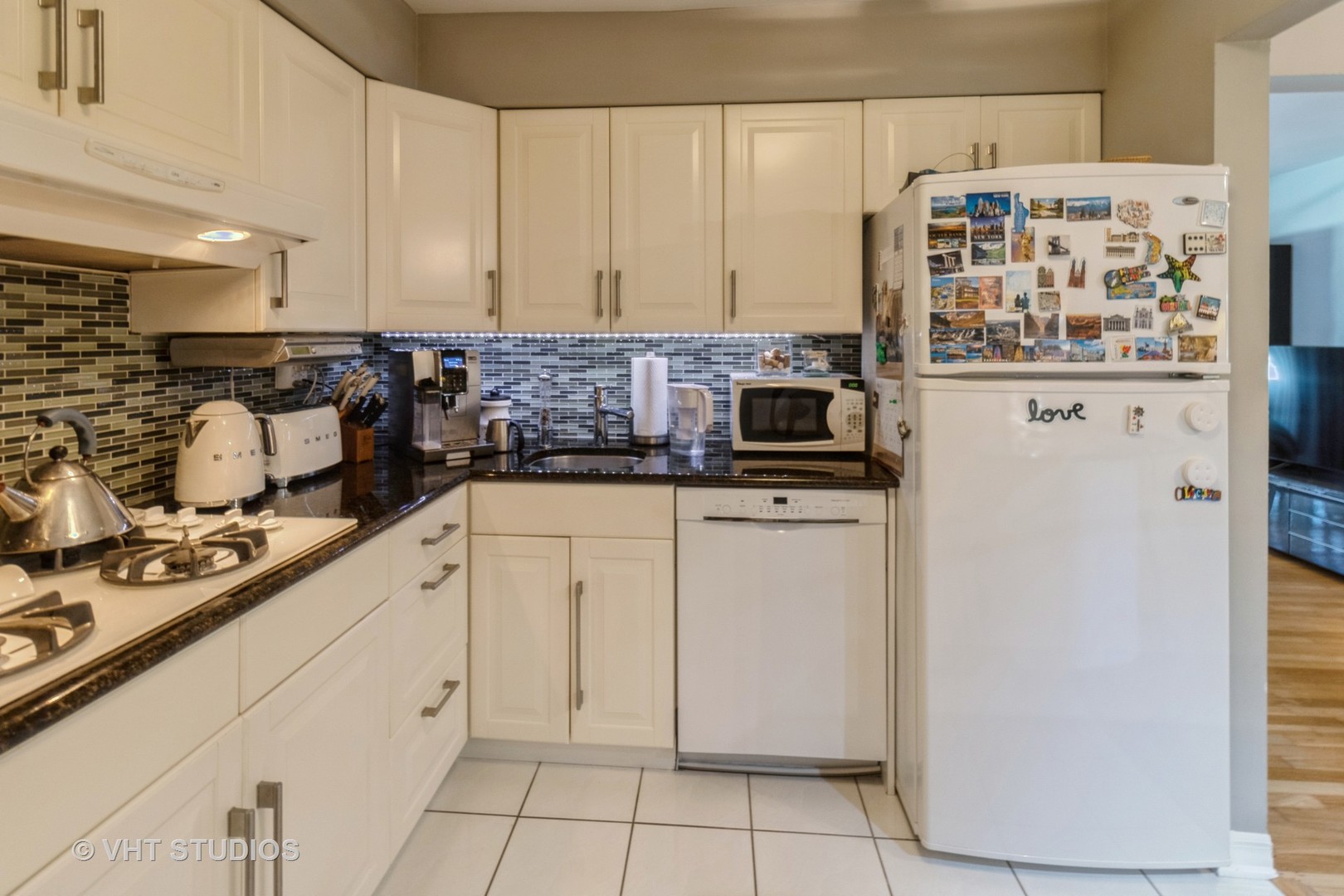 9500 Dee Road, Unit 106F Des Plaines, IL 60016 - Photo 15 of 28 a kitchen with stainless steel appliances a refrigerator and cabinets