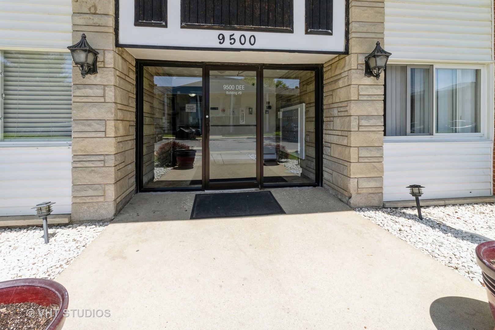 9500 Dee Road, Unit 106F Des Plaines, IL 60016 - Photo 4 of 28 a view of a building entrance
