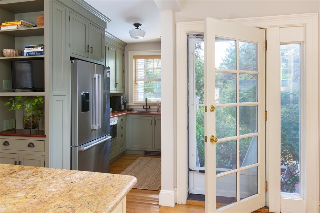 17 Coolidge Street Brookline, MA 02446 - Photo 15 of 41 a kitchen with stainless steel appliances granite countertop a refrigerator and a sink