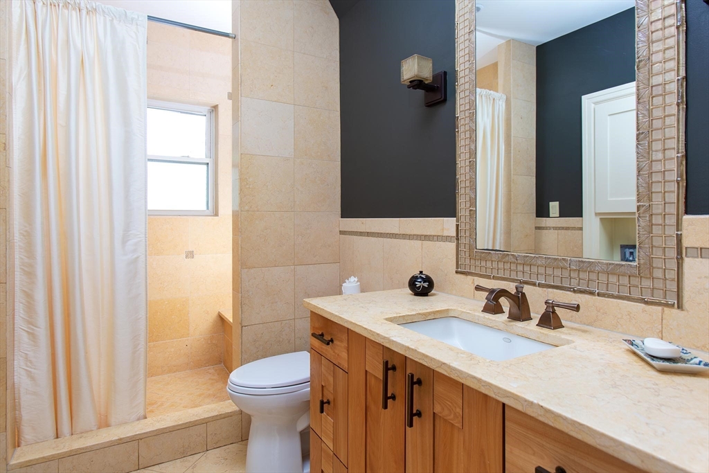 17 Coolidge Street Brookline, MA 02446 - Photo 20 of 41 a bathroom with a sink a toilet and shower