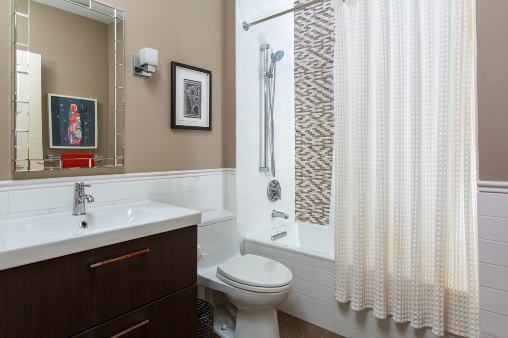 17 Coolidge Street Brookline, MA 02446 - Photo 25 of 41 a bathroom with a sink toilet and shower