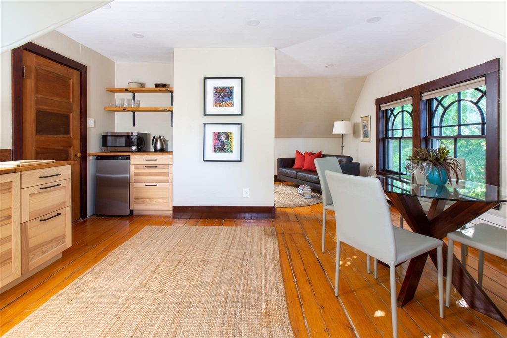17 Coolidge Street Brookline, MA 02446 - Photo 28 of 41 a living room with stainless steel appliances granite countertop furniture and a wooden floor