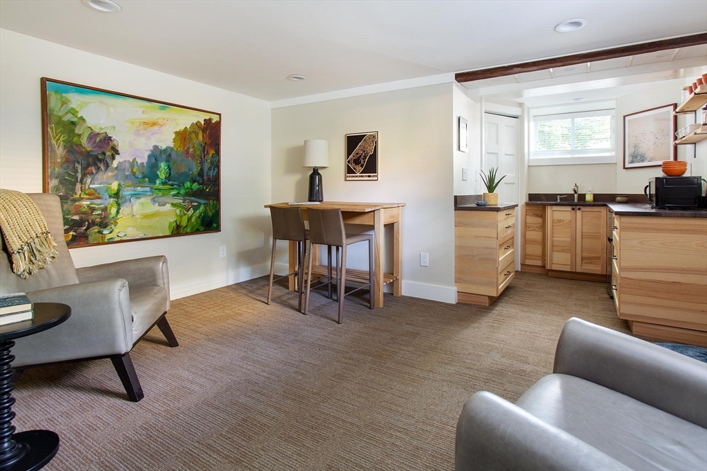 17 Coolidge Street Brookline, MA 02446 - Photo 31 of 41 a living room with furniture and a large window