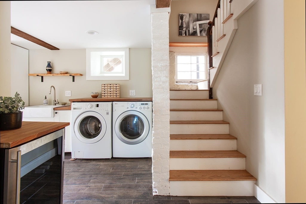 17 Coolidge Street Brookline, MA 02446 - Photo 33 of 41 a view of a hallway with washer and dryer