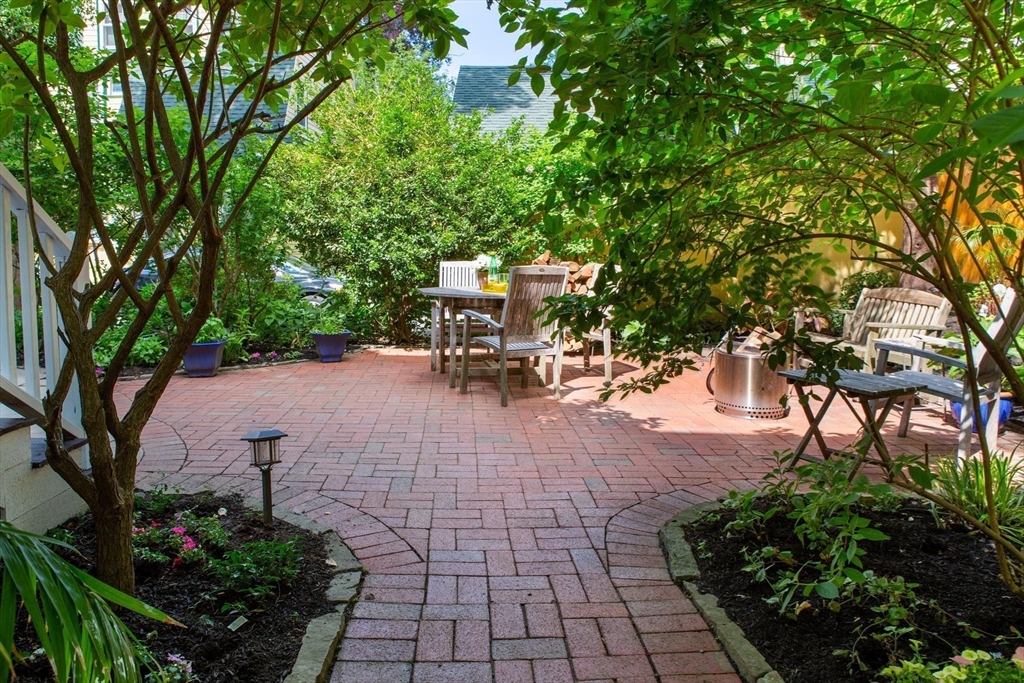 17 Coolidge Street Brookline, MA 02446 - Photo 38 of 41 a view of a backyard with sitting area