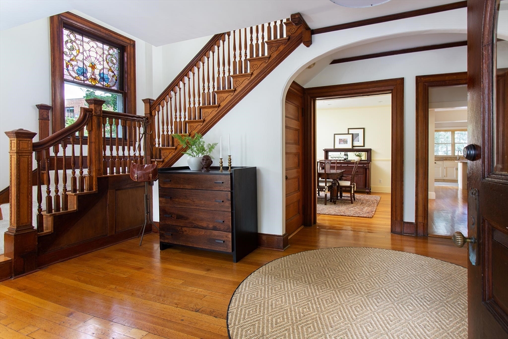 17 Coolidge Street Brookline, MA 02446 - Photo 4 of 41 a living room with furniture and a wooden floor
