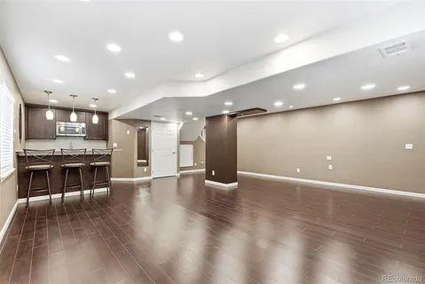 a view of a dining area with furniture and wooden floor