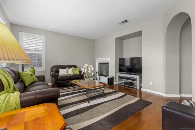 a living room with furniture and a table
