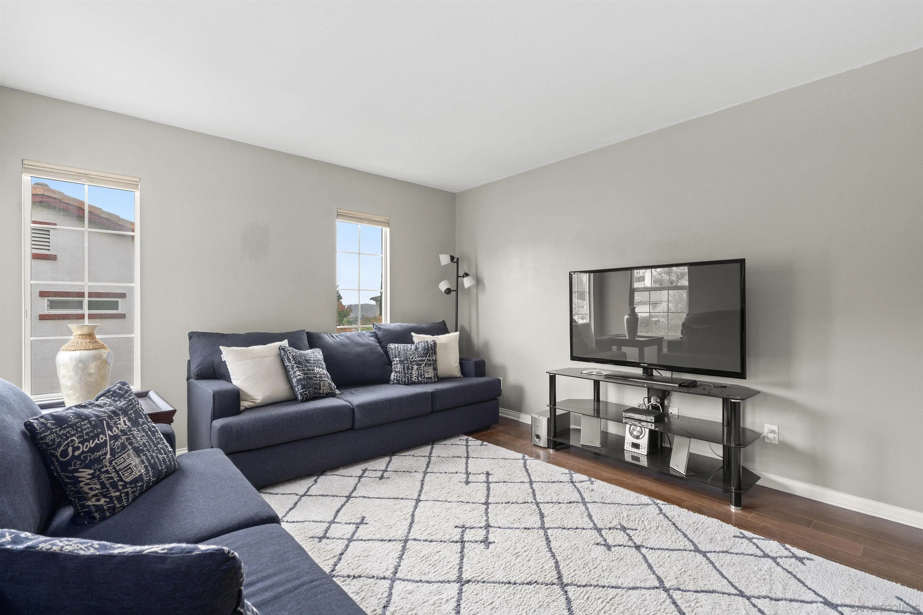 840 Luminara Way San Marcos, CA 92078 - Photo 27 of 57 a living room with furniture and a flat screen tv