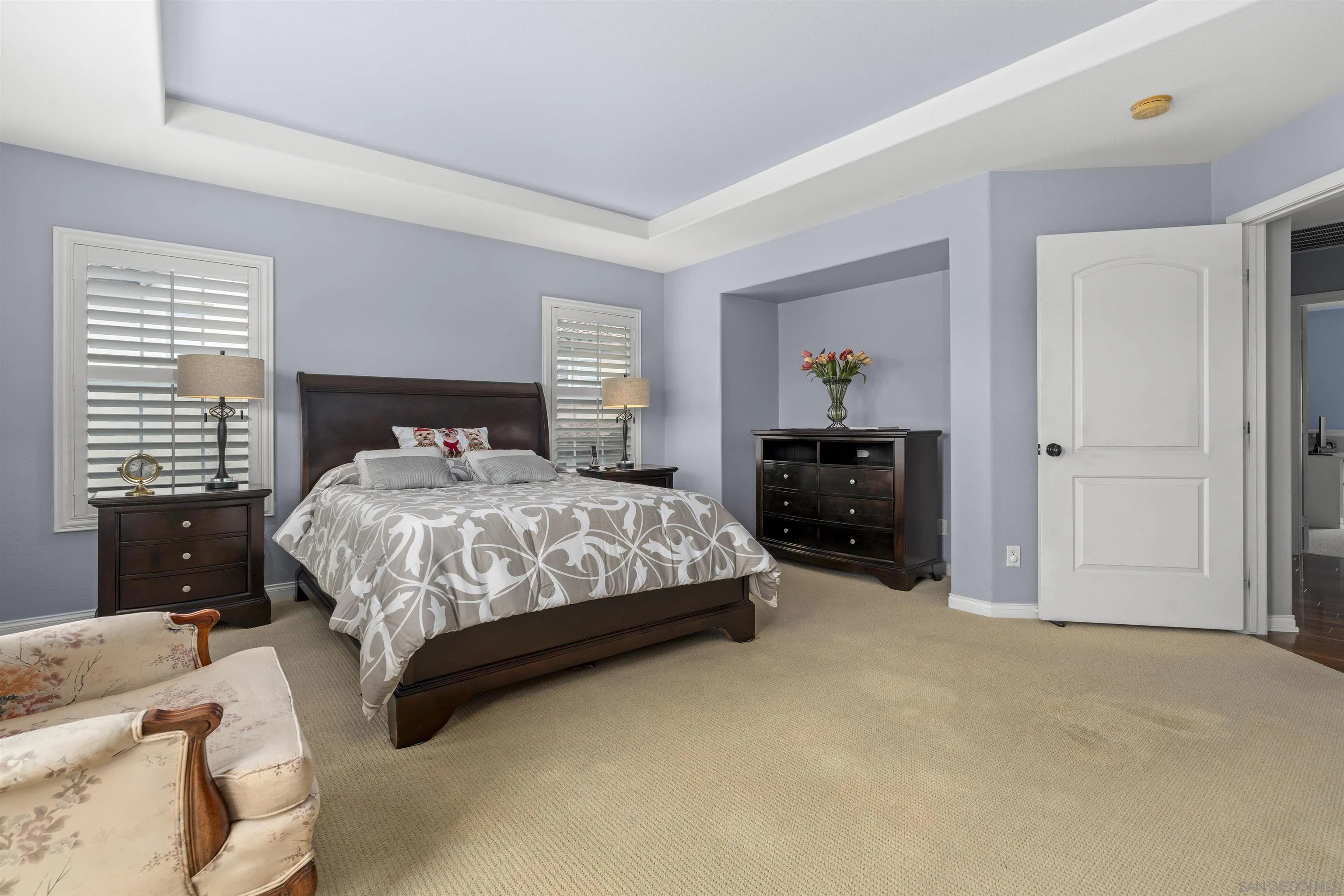 840 Luminara Way San Marcos, CA 92078 - Photo 28 of 57 a bedroom with a bed and a painting