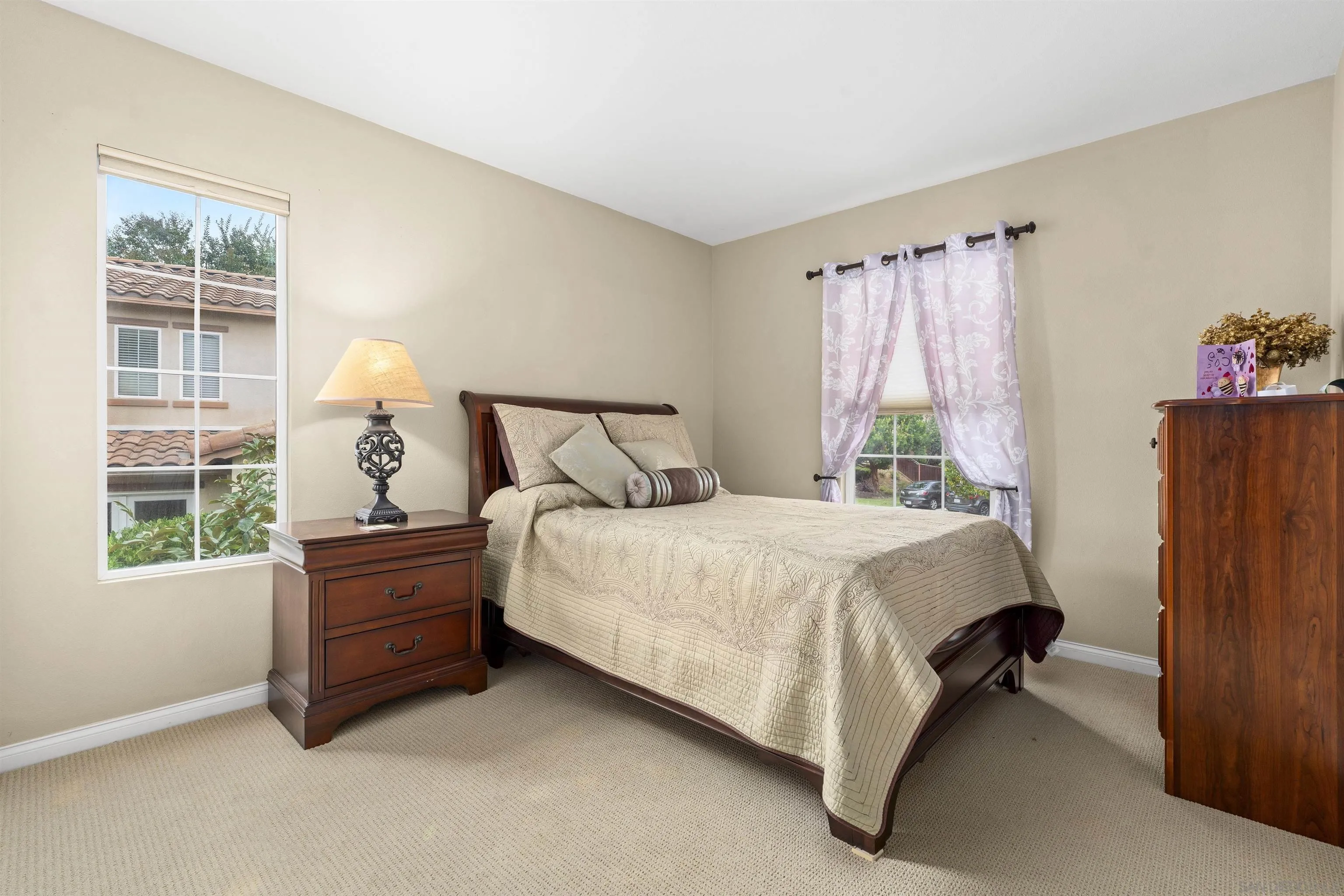 840 Luminara Way San Marcos, CA 92078 - Photo 41 of 57 a bed sitting in a bedroom next to a window
