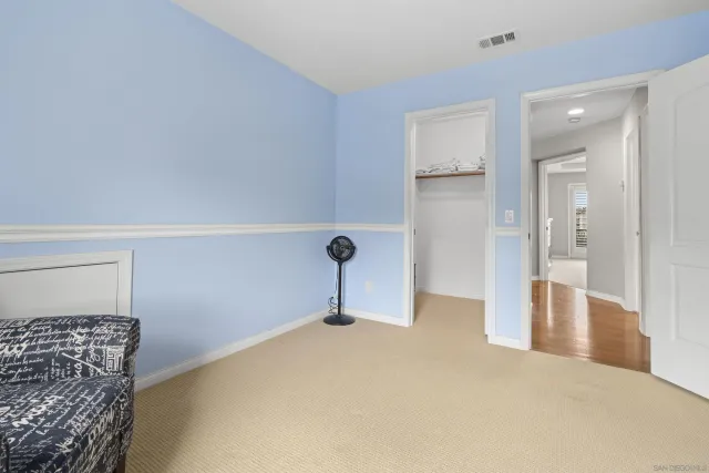 a view of backyard with outdoor seating and plants