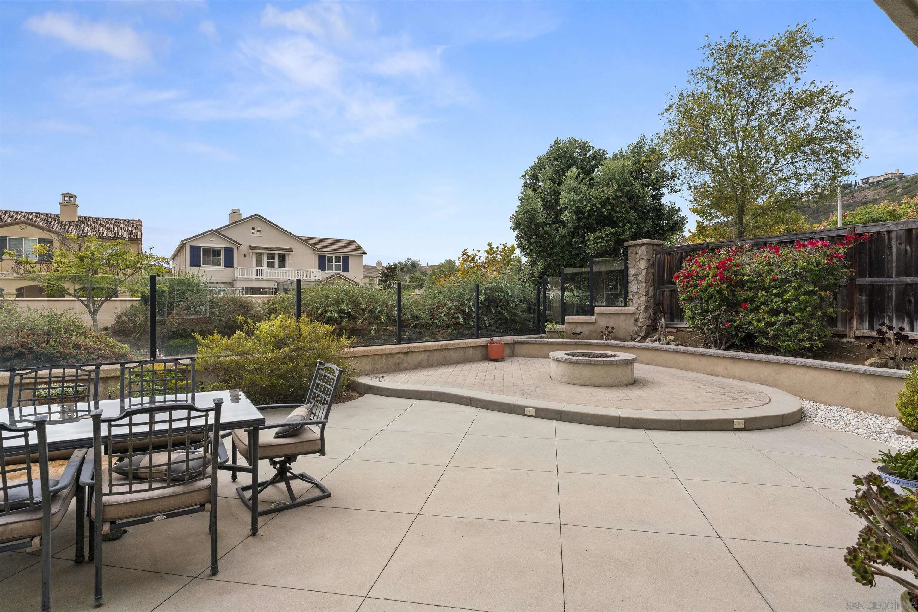 840 Luminara Way San Marcos, CA 92078 - Photo 48 of 57 a view of a patio with couches table and chairs and potted plants
