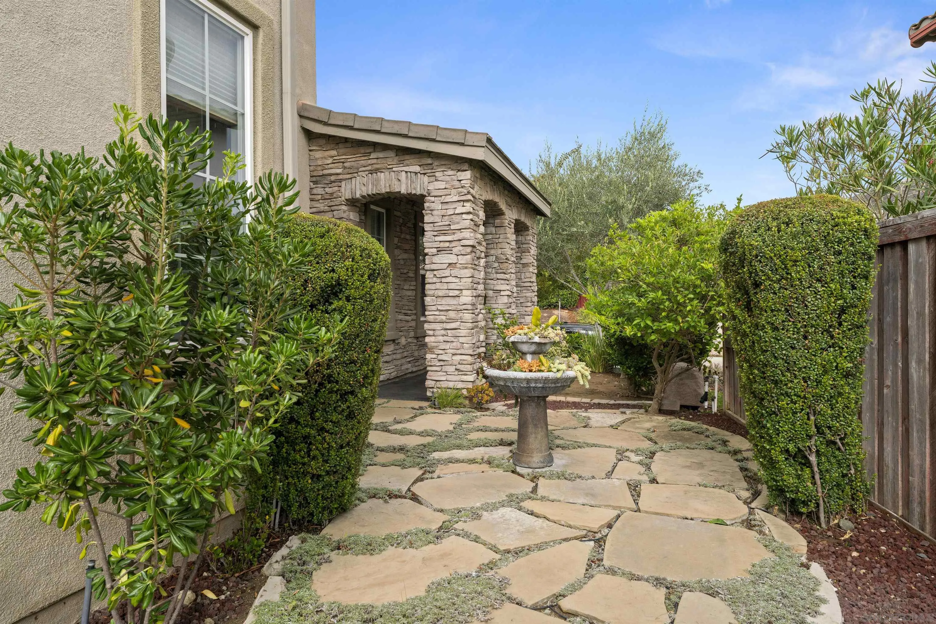 840 Luminara Way San Marcos, CA 92078 - Photo 55 of 57 a pathway of a house with potted plants