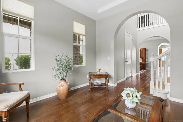 a view of living room filled with furniture and a potted plant