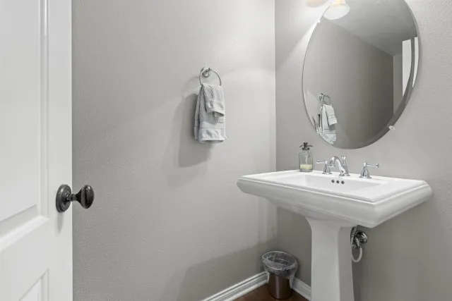 a living room with furniture and large windows