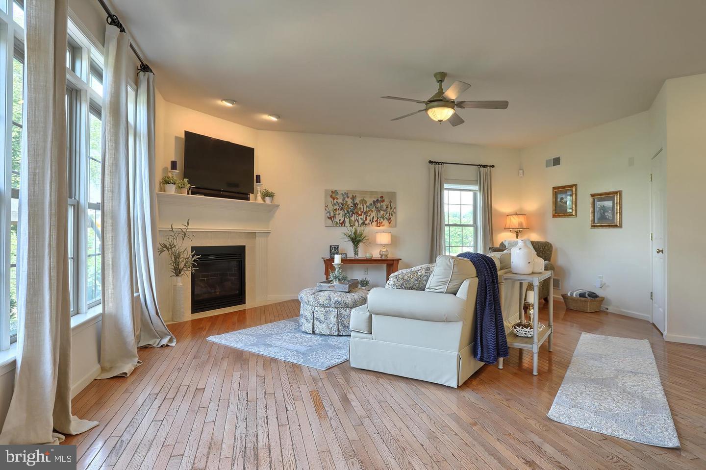 8 Rolling Meadow Road Lebanon, PA 17046 - Photo 11 of 16 a living room with furniture a fireplace and a flat screen tv