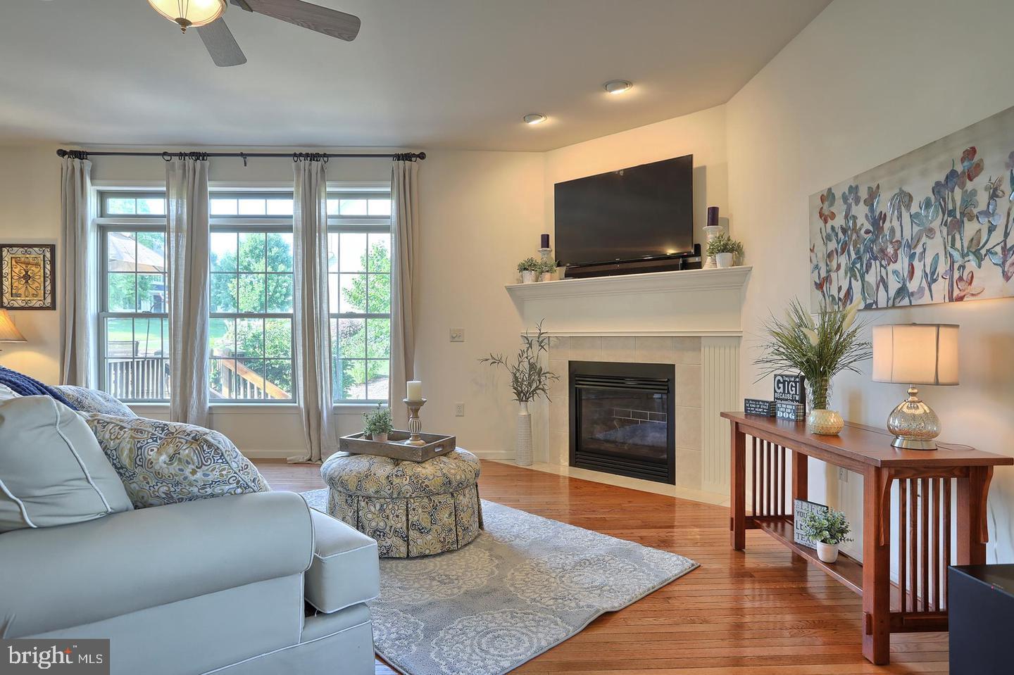 8 Rolling Meadow Road Lebanon, PA 17046 - Photo 12 of 16 a living room with furniture a flat screen tv and a fireplace