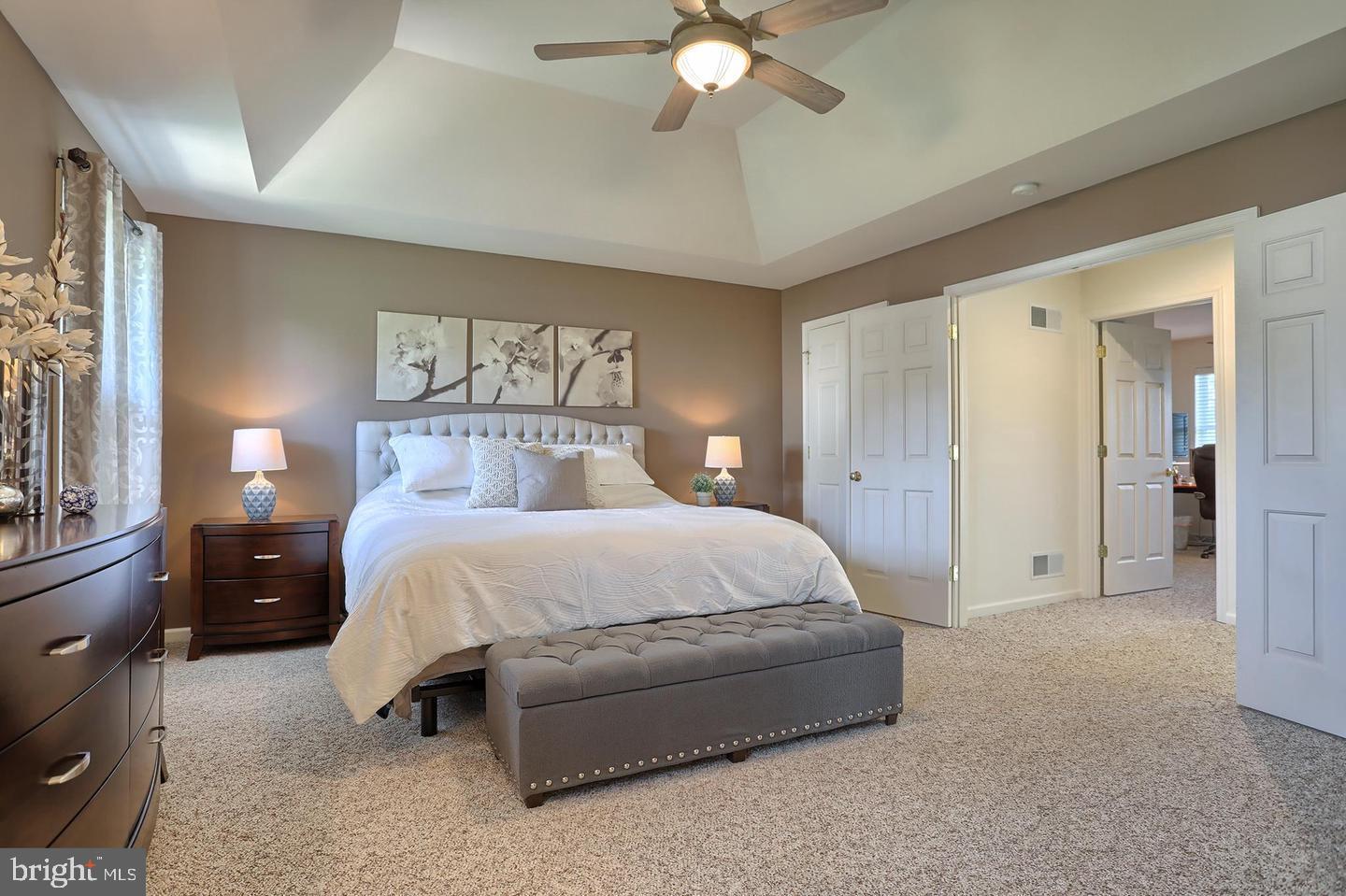 8 Rolling Meadow Road Lebanon, PA 17046 - Photo 15 of 16 a spacious bedroom with a bed and a chandelier