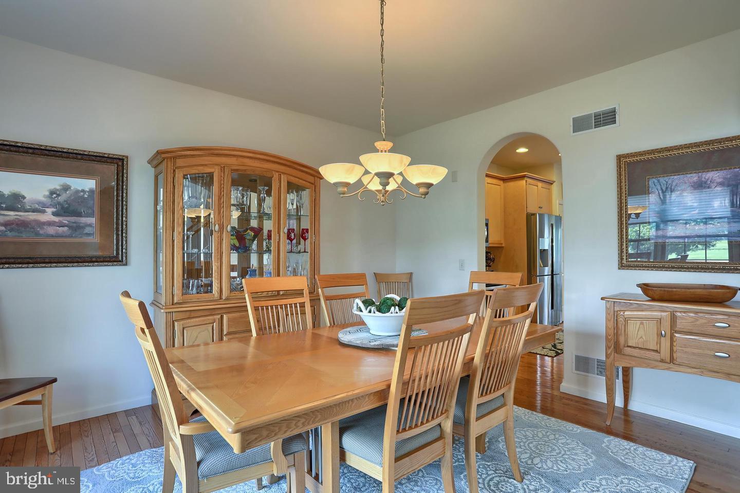 8 Rolling Meadow Road Lebanon, PA 17046 - Photo 3 of 16 a dining room with furniture a chandelier and wooden floor