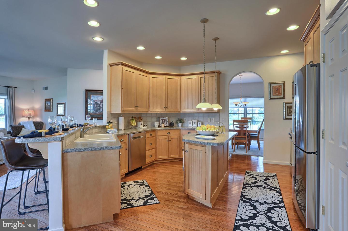 8 Rolling Meadow Road Lebanon, PA 17046 - Photo 8 of 16 a kitchen with kitchen island stainless steel appliances a stove a sink and a refrigerator