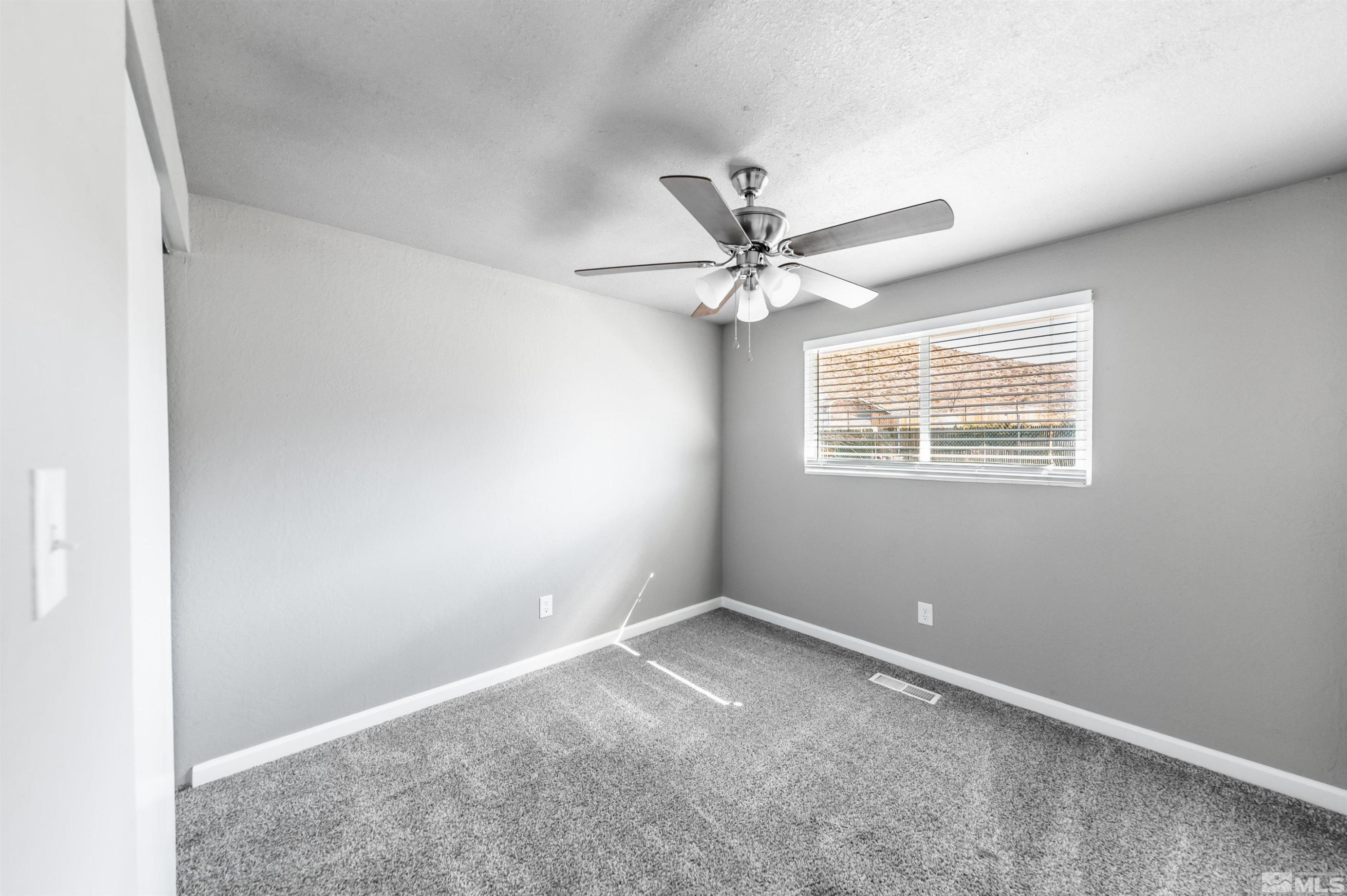 495 Kess Court Reno, NV 89506 - Photo 11 of 18 an empty room with a window