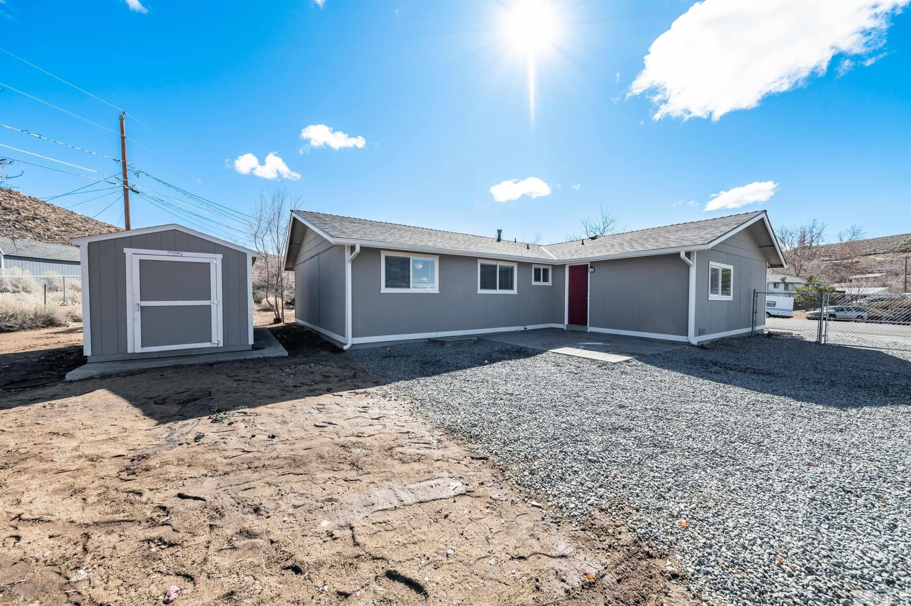 495 Kess Court Reno, NV 89506 - Photo 16 of 18 a front view of a house with a yard