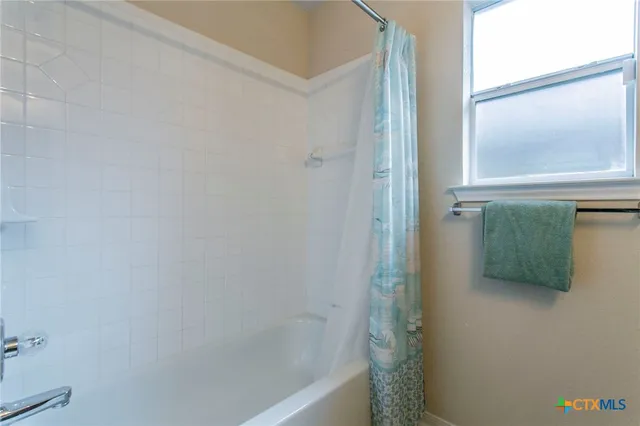 a bathroom with a bathtub