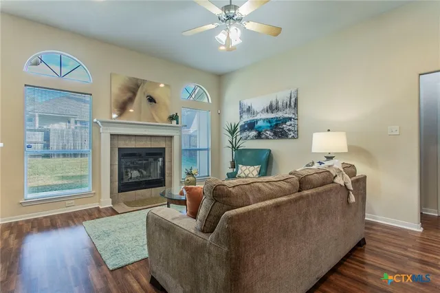 a living room with furniture and a fireplace