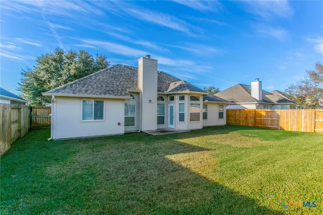 a house view with a garden space