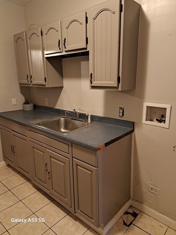 98 Brookline Street, Unit 3 Worcester, MA 01603 - Photo 24 of 33 a kitchen with stainless steel appliances granite countertop a sink a stove and cabinets
