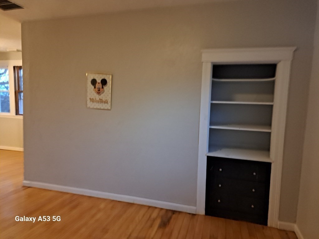 98 Brookline Street, Unit 3 Worcester, MA 01603 - Photo 25 of 33 a view of an empty room with a closet