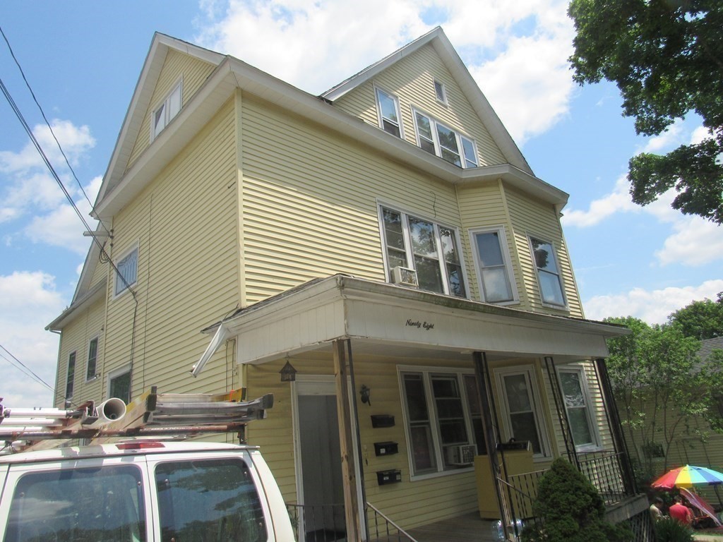 98 Brookline Street, Unit 3 Worcester, MA 01603 - Photo 6 of 33 a front view of a house with balcony