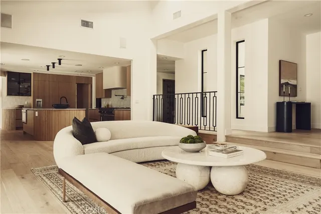 a kitchen with stainless steel appliances a sink and a stove