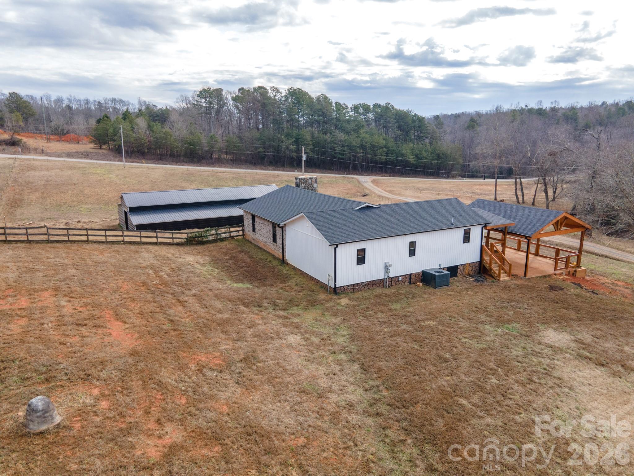 7400 Corn Hill Road Connelly Springs, NC 28612 - Photo 34 of 41 a backyard of a house with table and chairs