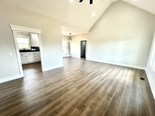 a view of a livingroom with wooden floor