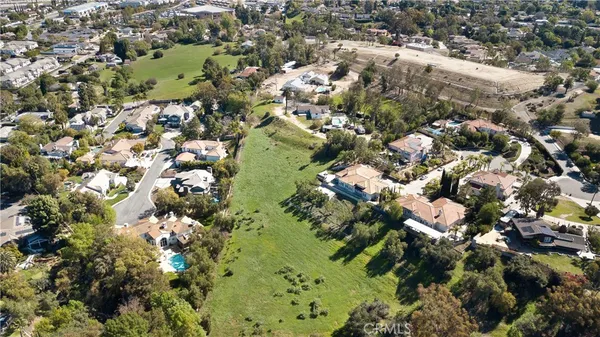 aerial view of a house with a yard