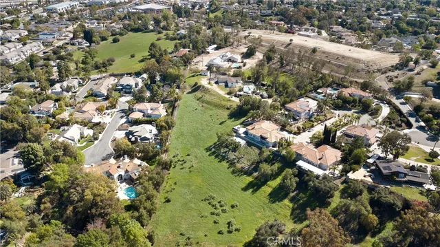 aerial view of a house with a yard