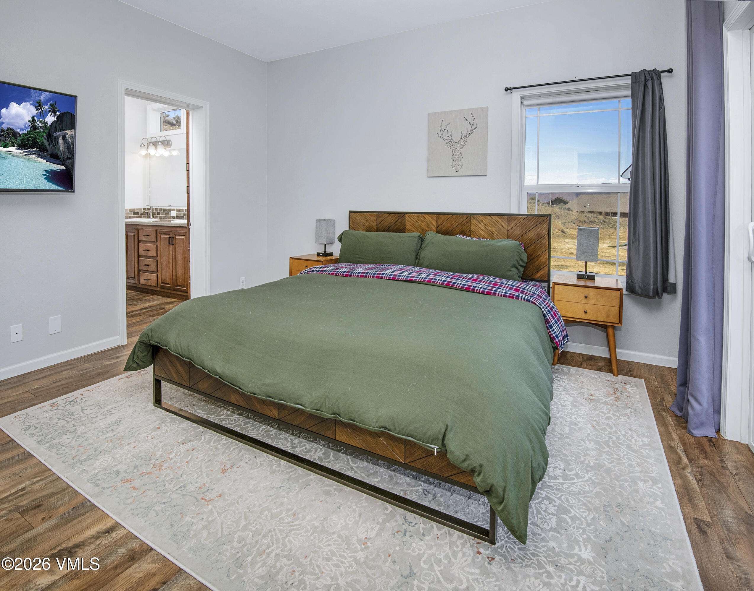 67 Maverick Court Gypsum, CO 81637 - Photo 14 of 40 a bed sitting in a bedroom next to a window