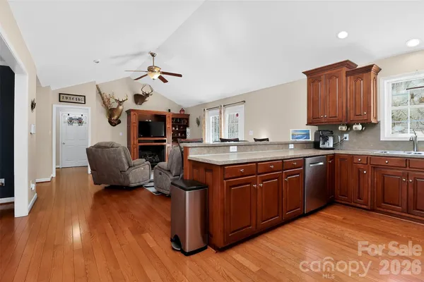 a kitchen with stainless steel appliances a stove microwave and refrigerator