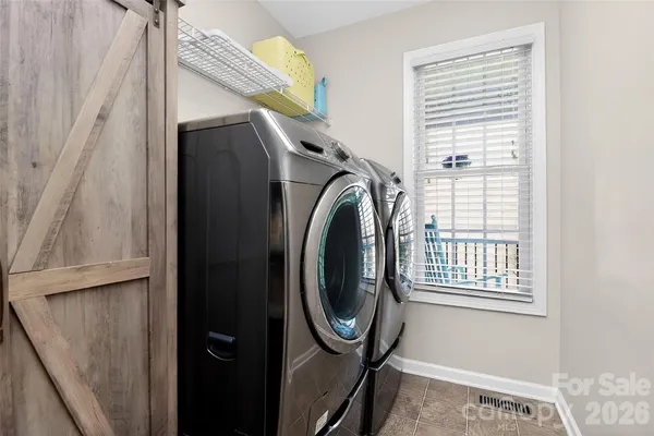 a bedroom with a bed and flat screen tv