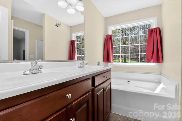 a bathroom with a bathtub and shower